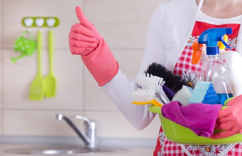 Cleaning staff performing a detailed kitchen and bathroom clean