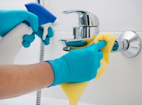 Supervisor reviewing safe cleaning procedures with staff